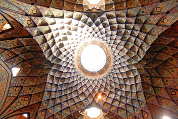 KASHAN, IRAN - August 14, 2017: The splendid interior of medieval Timche-ye Amin od-Dowleh (Aminoddole Caravanserai) great hall of the historical Grand Bazaar