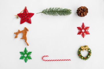Christmas Background with decorations on white paper. Creative flat lay, top view design