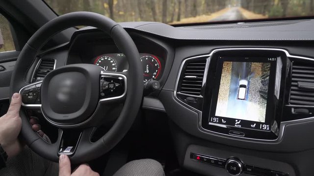 Modern car ride on the road, car interior, modern navigation system dashboard view, transportation.
