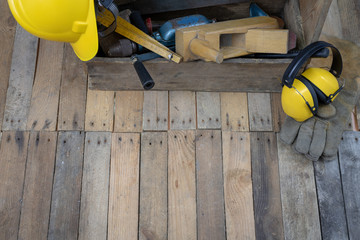 Old crate cabinet with tools on a wooden table. Accessories for a manual worker in a workshop.