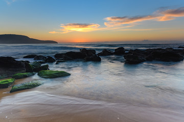 Sun, Sand, Sea and Rocky Sunrise