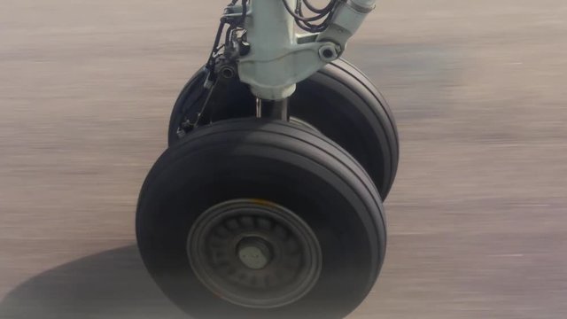 View on airplane wheel at landing, close up shot