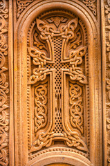 Plakat Engraved and framed by an arched border cross with intertwining ornament on a bright red volcanic stone 