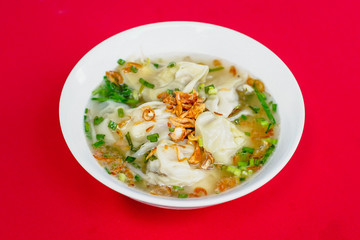 Fototapeta na wymiar Vietnamese Noodles with Pork and Shrimp Recipe bowl on the red carpet 