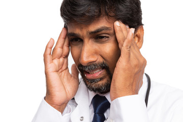 Doctor suffering headache close-up.