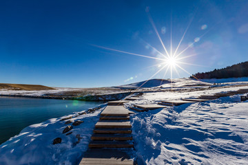   The frozen Sailimu lake with snow mountain background at Yili, Xinjiang of China