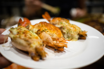 Steamed stuffed shrimps on white dish.