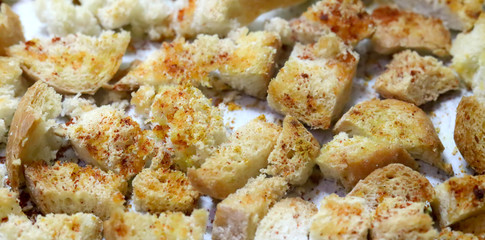 dried baked crispy bread crumbs with garlic, salt and paprika powder,close up  