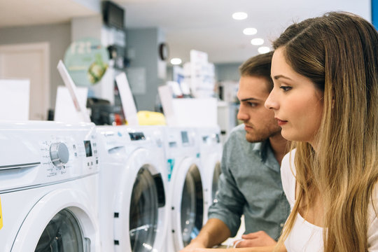 Young woman and man shopping home appliances