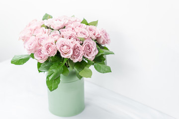 Roses lilac and pastel colors. Bright bouquet in metal bucket. concept of flower shop.