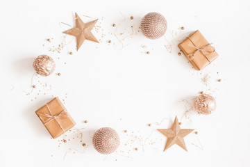 Christmas composition. Christmas gifts, golden decorations on white background. Flat lay, top view,...
