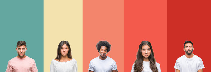 Fototapeta premium Collage of different ethnics young people over colorful stripes isolated background depressed and worry for distress, crying angry and afraid. Sad expression.