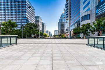 Panoramic skyline and modern business office buildings with empty road,empty concrete square floor