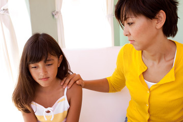 Portrait of a mother and daughter hugging