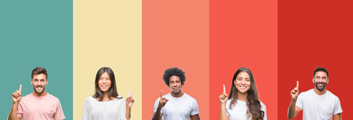 Collage of different ethnics young people over colorful stripes isolated background showing and pointing up with finger number one while smiling confident and happy.