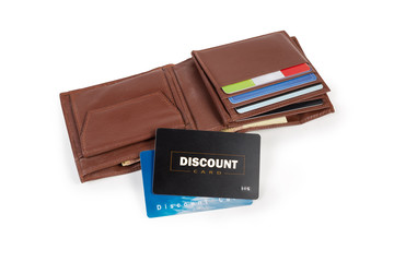 Two plastic discount cards on open brown leather wallet