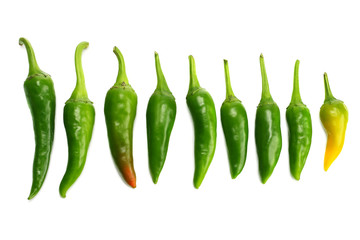 green hot chili peppers isolated on white background top view