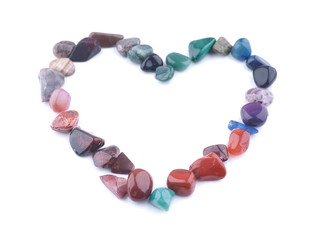 heart of colored stones on a white background