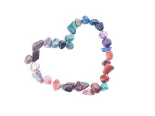 heart of colored stones on a white background