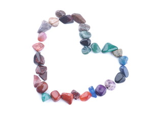 heart of colored stones on a white background