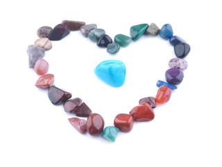heart of colored stones on a white background