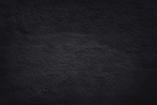 Dark grey black slate texture in natural pattern with high resolution for background and design art work. Black stone wall.