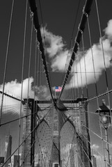 Central view standing on Brooklyn bridge American flag steel rope