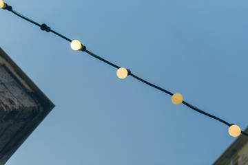 Lanterns on the authentic narrow colorful mediterranean street in the Chania town at the dusk. Island of Crete, Greece