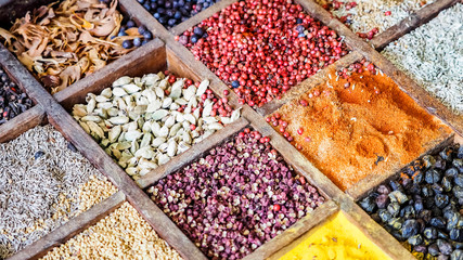 Collection colorful mosaic spices in wooden box. Assortment of condiment cooking ingredient. Seasoning background banner
