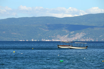 Obraz premium small fishing boats on Lake Ohrid landscape Macedonia