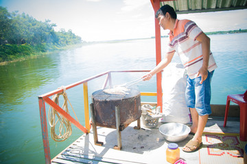 travel man cooking on travel boat