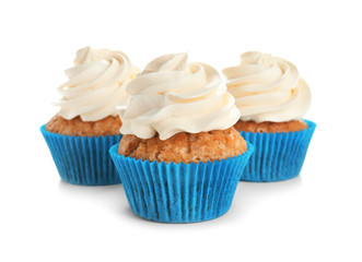 Delicious cupcakes on white background