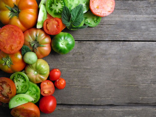 tomatoes, red, yellow , orange, green, healthy food, wooden background.natural ingredients. berries.