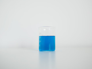 Laboratory beaker on white table