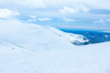 Fototapeta na wymiar Ukrainian Carpathian mountains in winter. Dragobrat View from the top. Snow drops Winter fairy tale. Traveling
