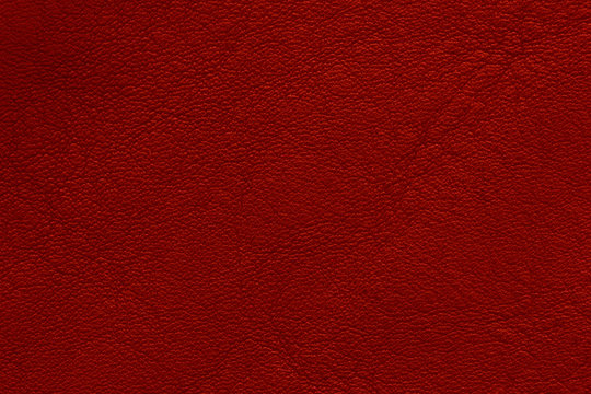 Red elegance leather texture for background with visible details 