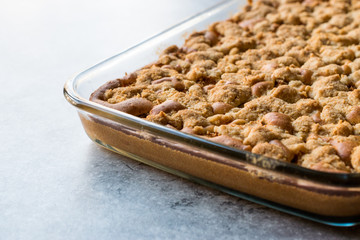 Homemade Whole Crumble Cake in Glass Bowl. Freshly Baked.