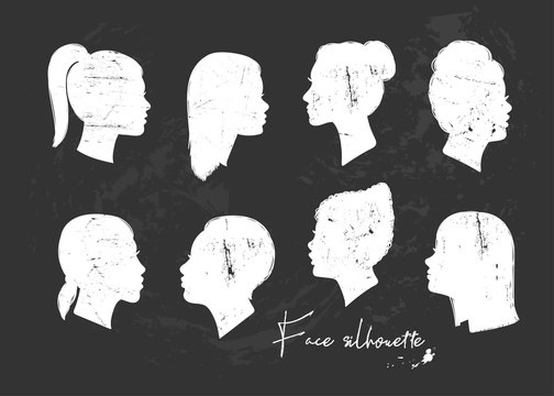 Various women faces silhouettes.  Black background. Hand drawn vector set. All elements are isolated