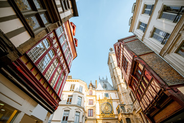 Street view with ancient buildings and Great clock on renaissance arch, famous astronomical clock in Rouen, the capital of Normandy region - obrazy, fototapety, plakaty