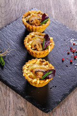 Canape with mushroom and cheese