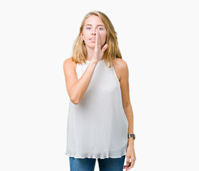 Fototapeta premium Beautiful young elegant woman over isolated background hand on mouth telling secret rumor, whispering malicious talk conversation