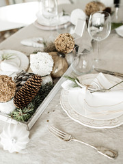 Dishware and New Year decorations on table.