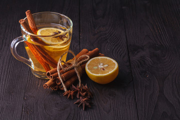 winter hot drink mulled wine with cinnamon and lemon