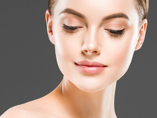 Fototapeta premium Beauty healthy skin closeup face woman natural makeup eyes and lips