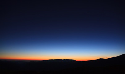 Obraz premium Mountains at sunset. The rocky ridge of the North Caucasus in Russia.