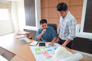 portrait engineer people working and discussing with blueprint in office, using as background
