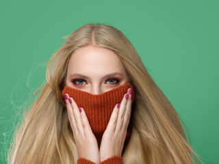Woman in knitted sweater fashion with blonde long hair autumn stylish