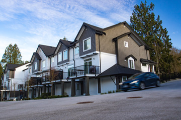 Great and comfortable neighborhood. A row of townhouses at the empty street.