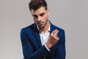 closeup picture of a young elegant man snapping his fingers