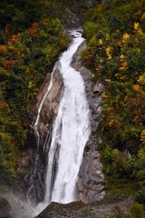 Waterfall with colorful autumn trees in Sichuan, China